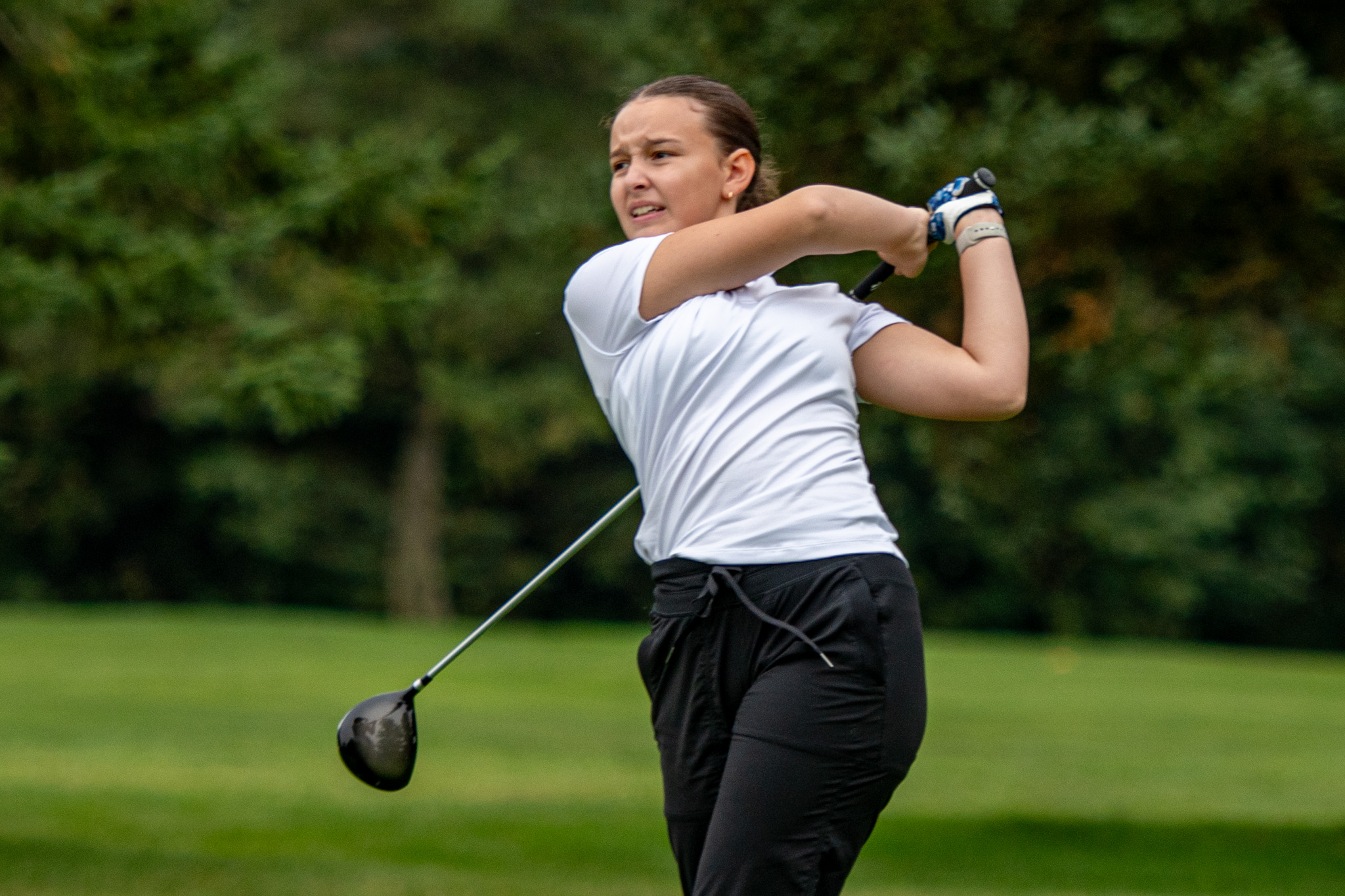 West Elgin Wildcats Addison Peacock watches her tee shot.
