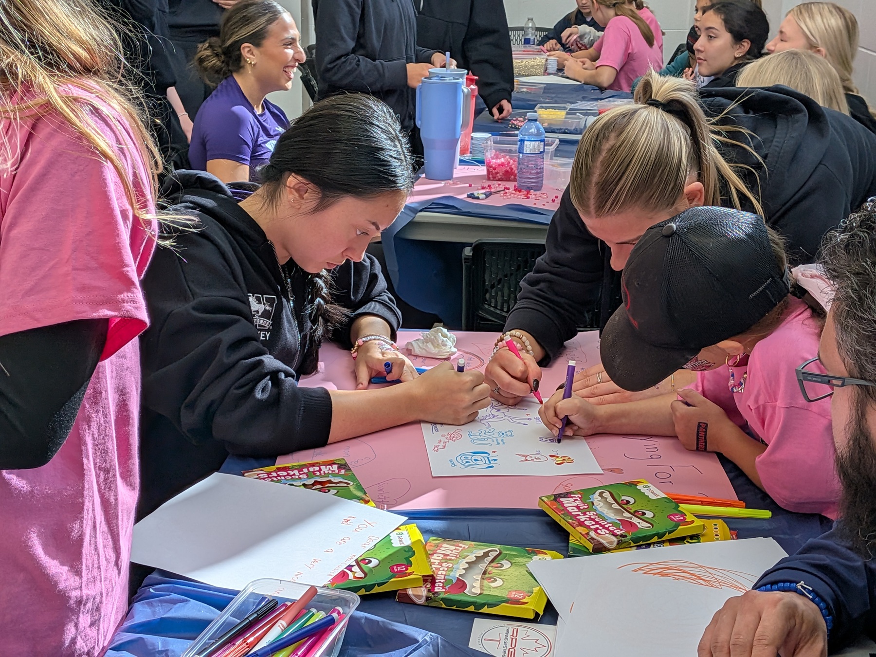 Western Mustangs women's hockey team took a break from playing to join in on the activities.