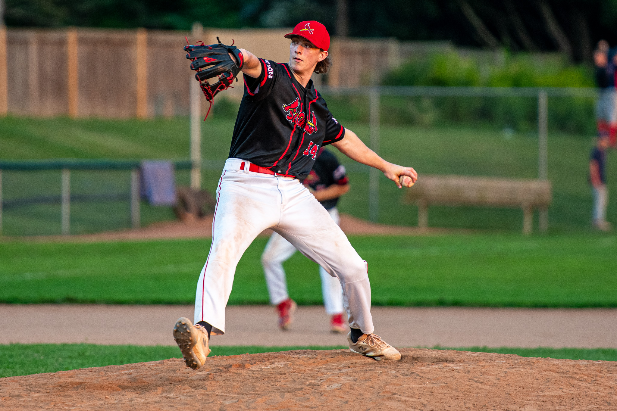St. Thomas Cardinals pitcher Andrew Oates sets to deliver against Listowel