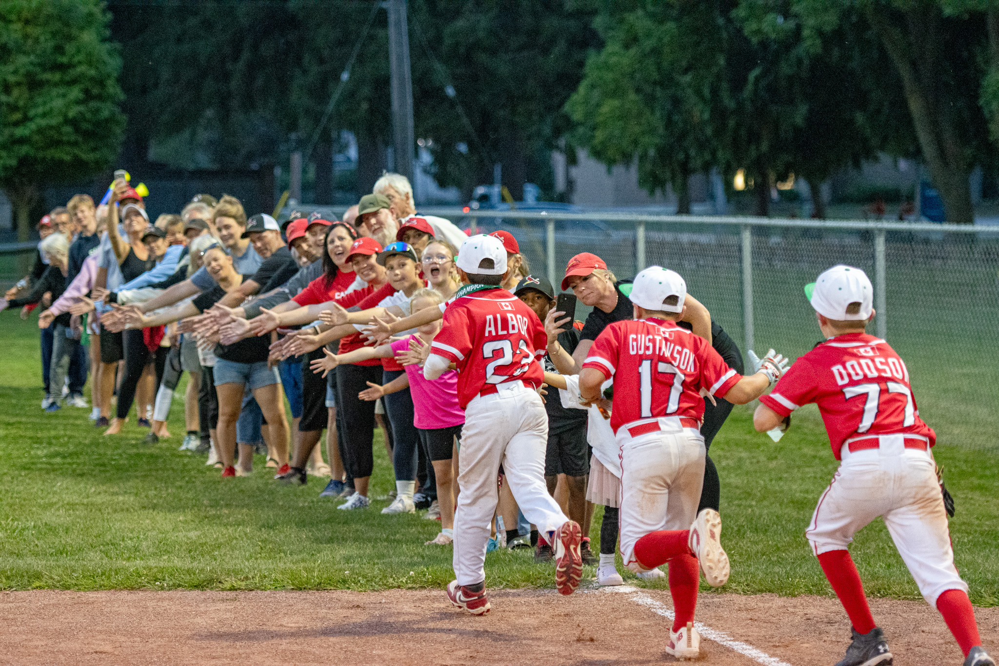 The St. Thomas Cardinals players bring the celebration to parents and fans.