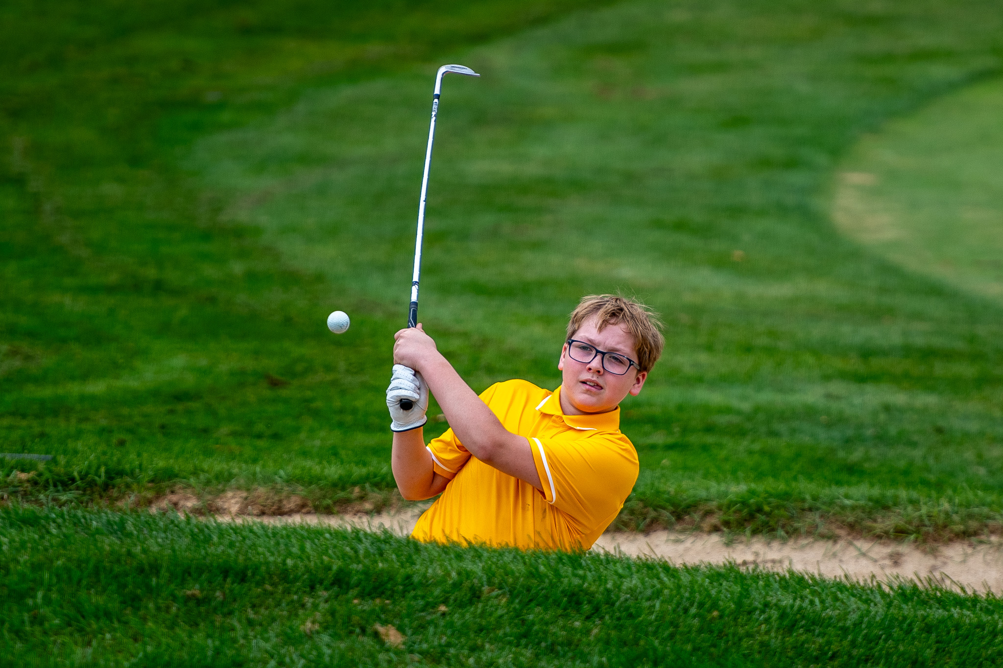 Central Elgin Titans Finn Rumas from the sand bunker at TVRA Tri-County boys golf.