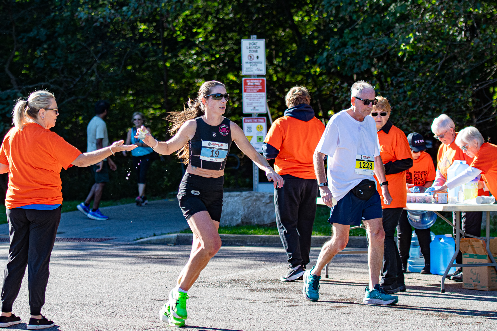 Nico Bernardi grabs a drink during the half marathon.