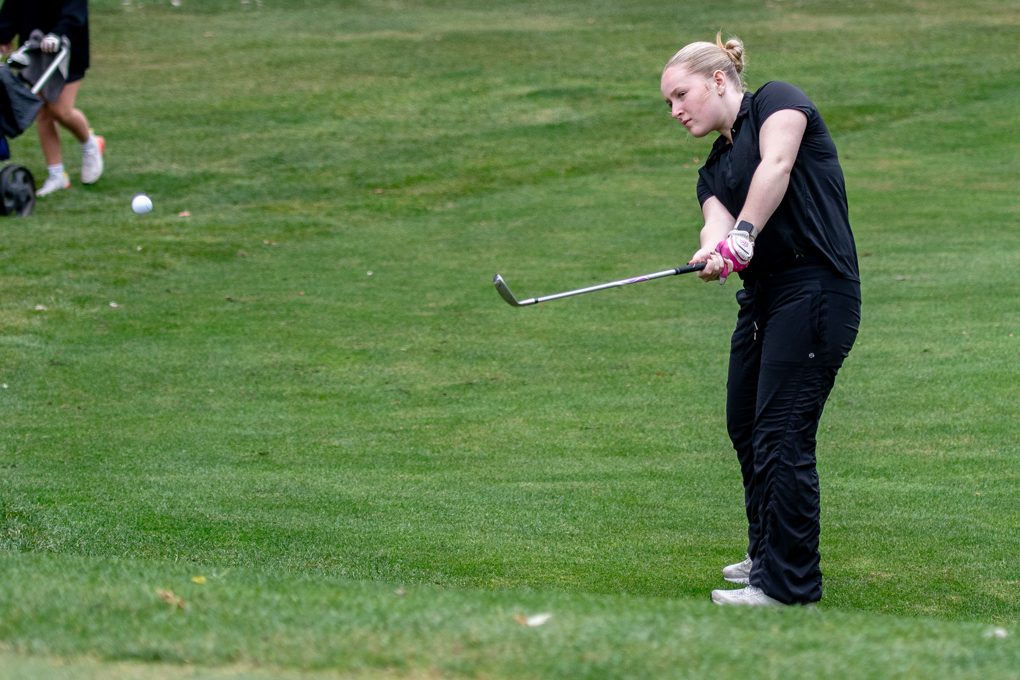 West Elgin Wildcats June Ross chips closer to the hole.
