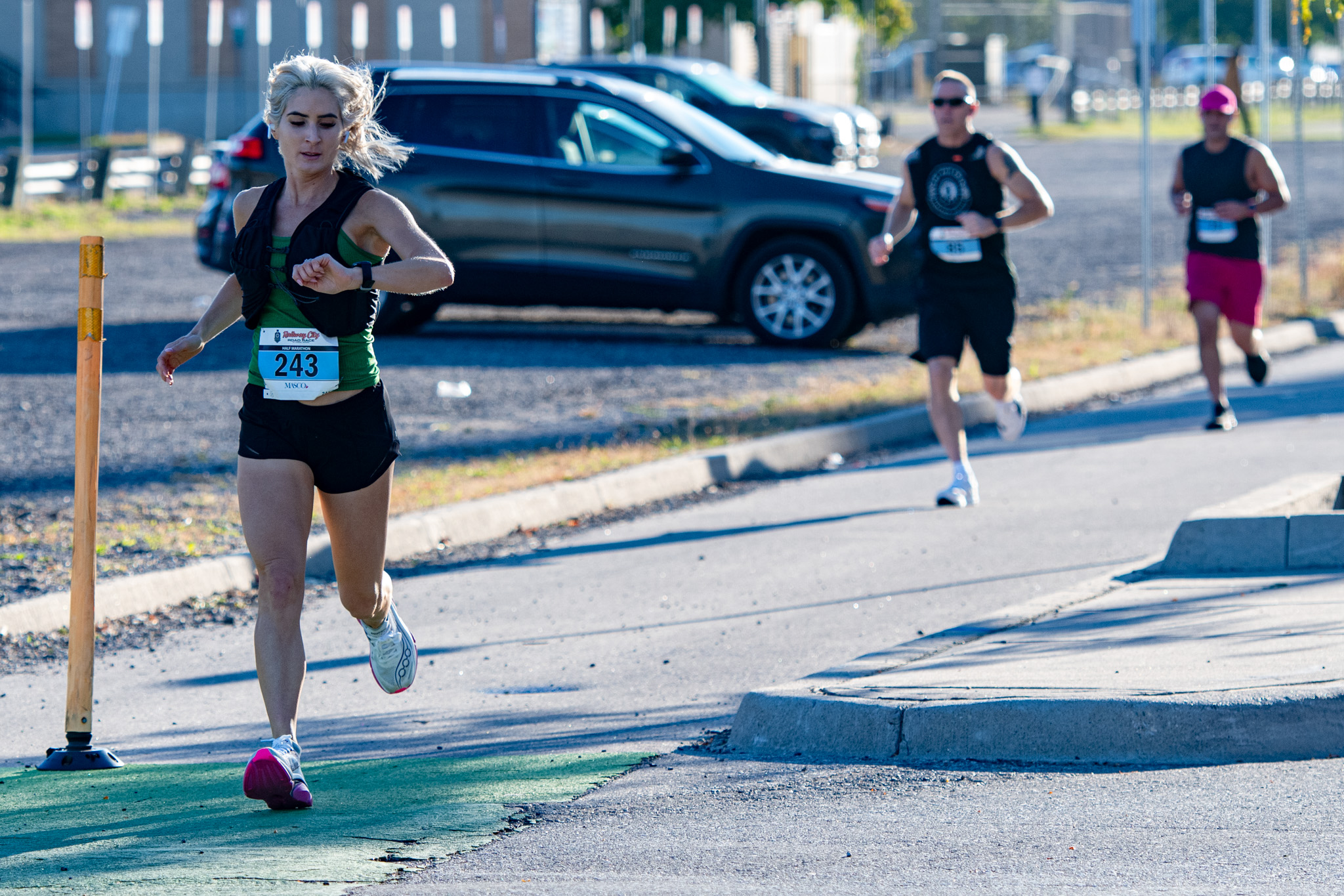 Nissa Vandenbogaard checks her time early in the half marathon.