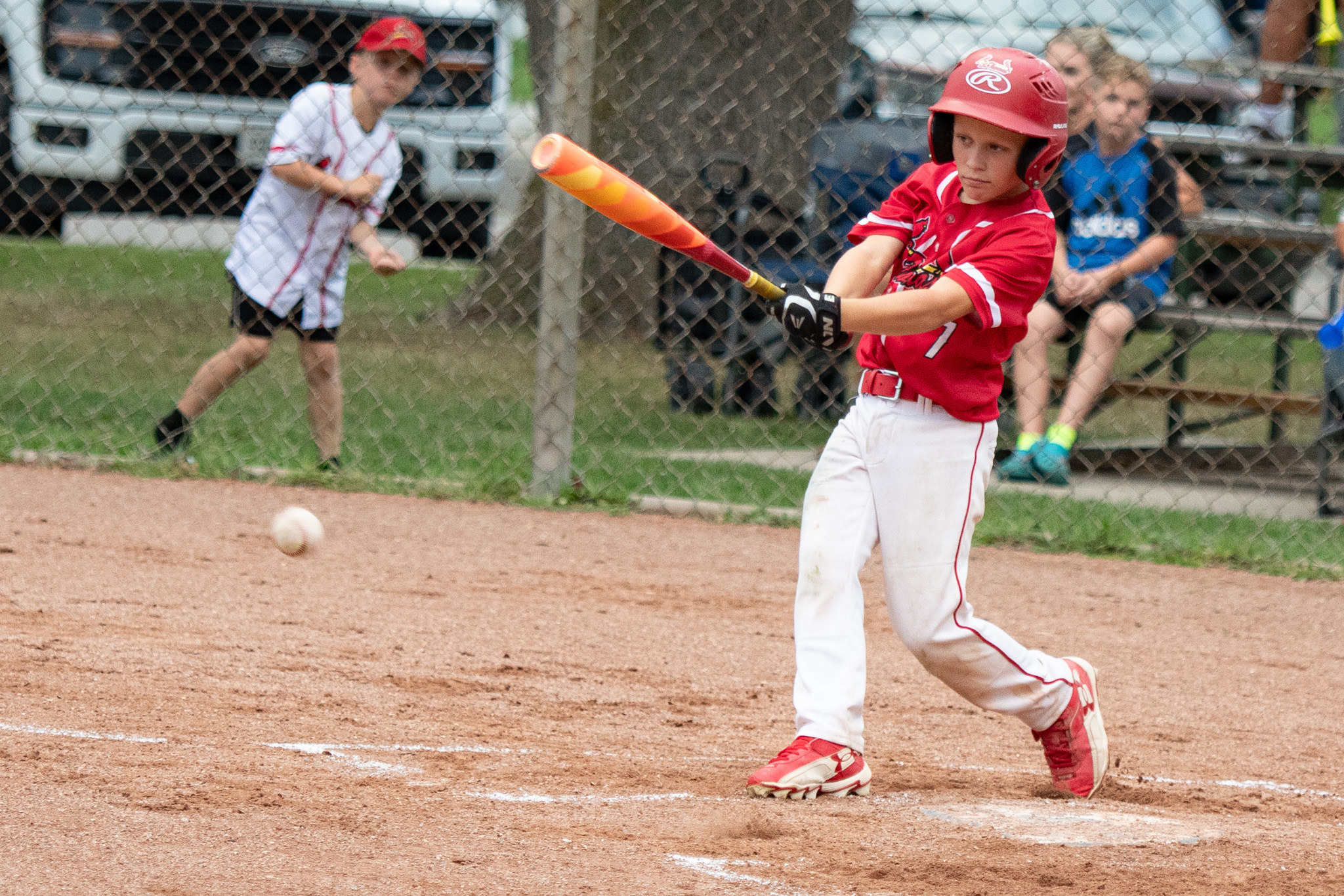 St. Thomas Cardinals Cohen Coombs makes contact for a single against the Leamington Lakers.