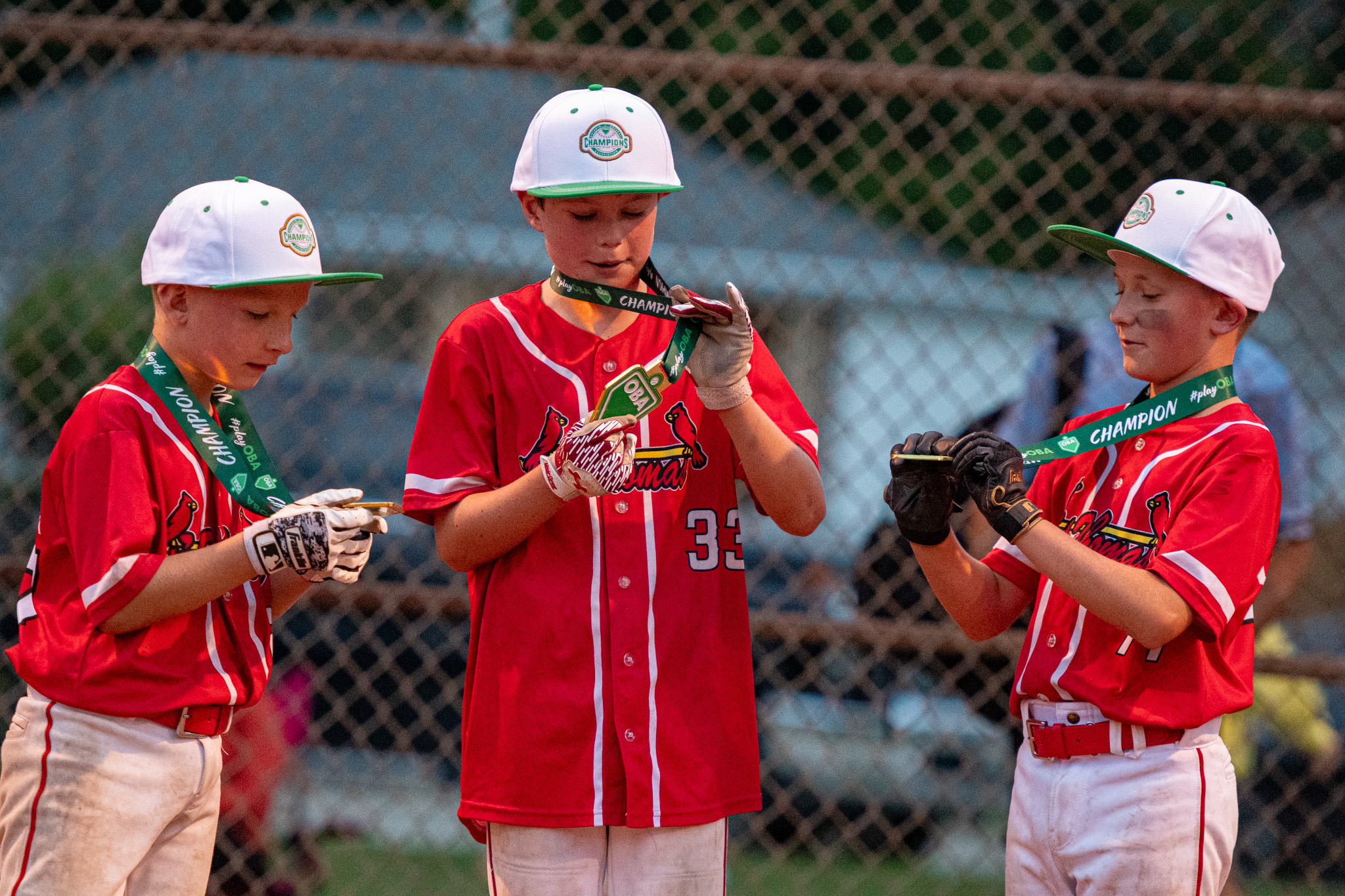 St. Thomas Cardinals Ben Wakefield, Nolan Dodson, check out their championship medals.