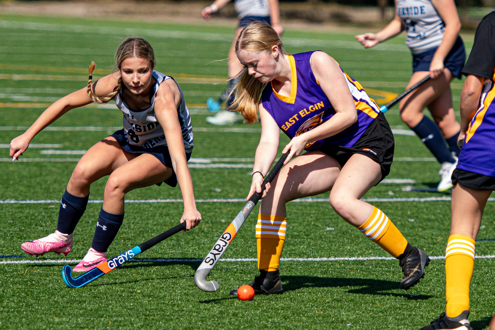 East Elgin Eagles Brooklyn DeAngelis turns to shake Parkside Stampeders Mackenzie Korpan.