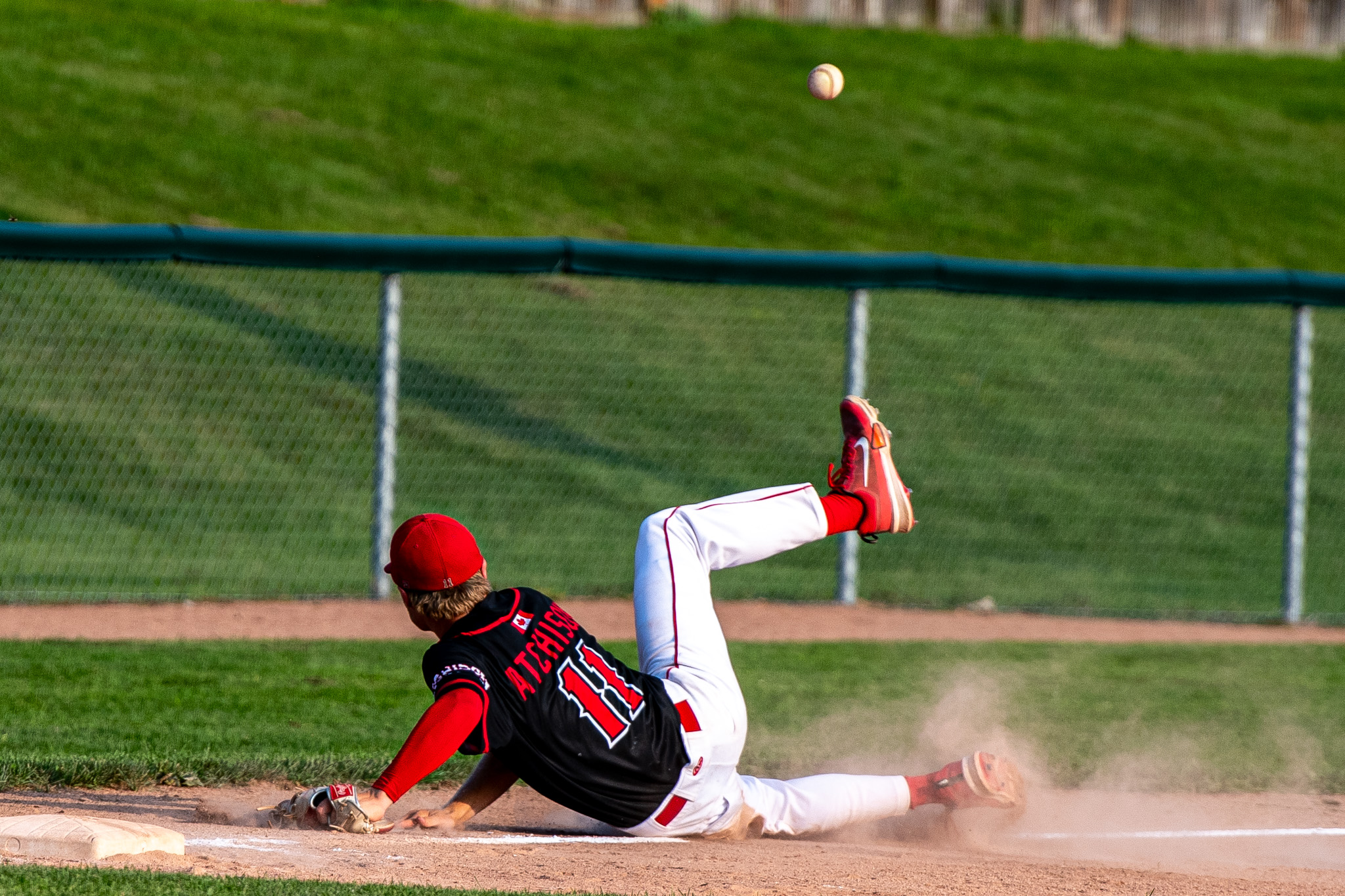 A hot shot down the third base line got the best of St. Thomas Cardinals Wyatt Atchison.
