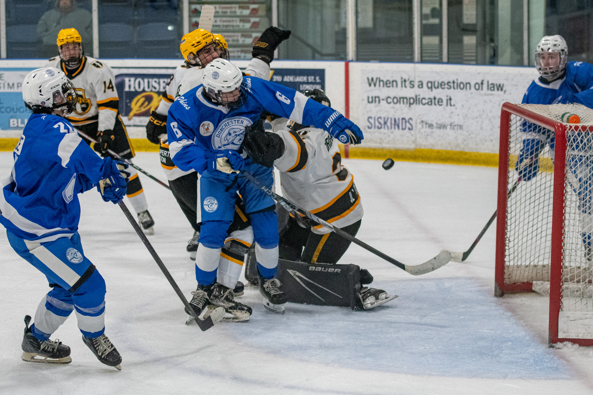 Dorchester Dolphins Connor Crandon (6) throws the puck in to the Tavistock Braves net late in the third period Saturday at the Flight Exec Centre. It did not count as a goal.