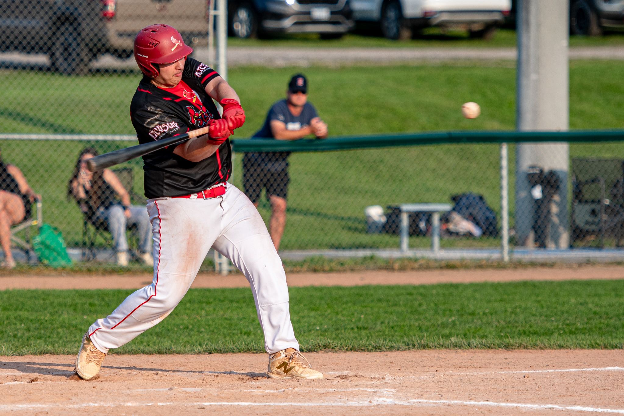St. Thomas Cardinals Tyler Serratore slaps out a single against Listowel.