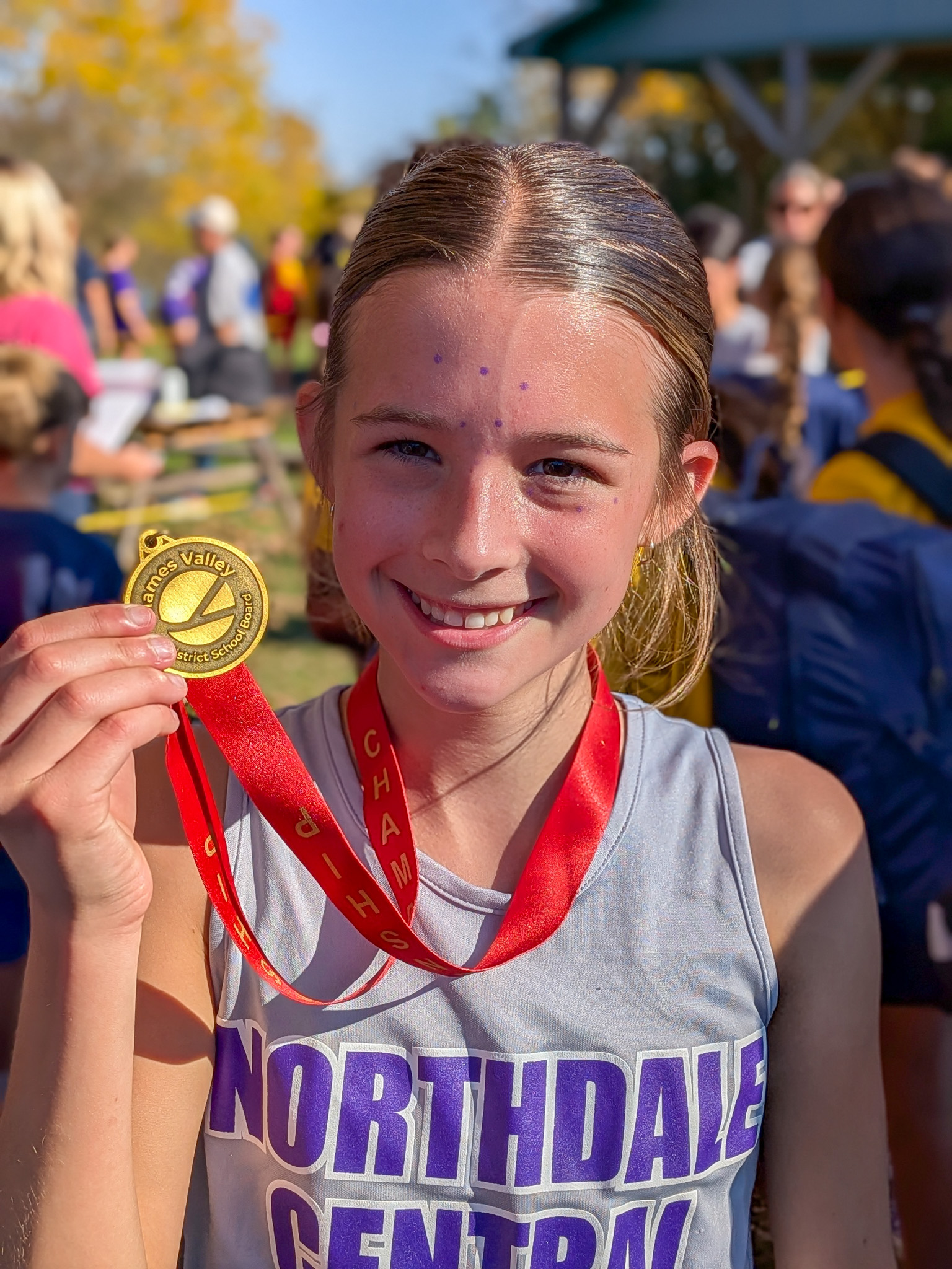 Brooke Samko with her third consecutive Valley cross country gold medal.